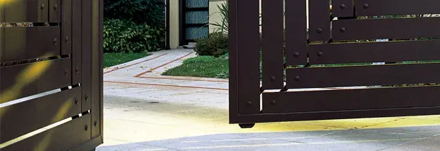 Automatic swing gates opening on a private driveway